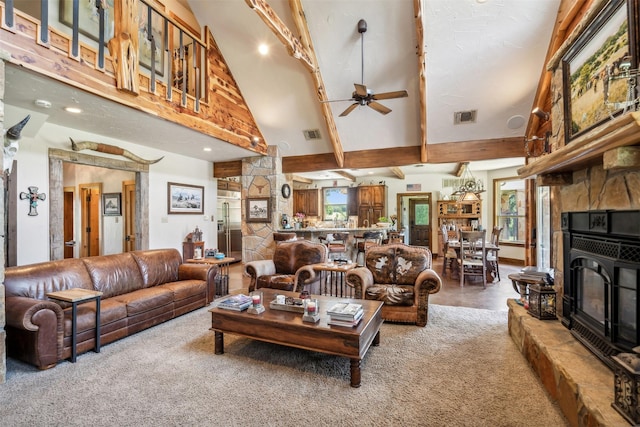 living room featuring a wood stove, high vaulted ceiling, and ceiling fan