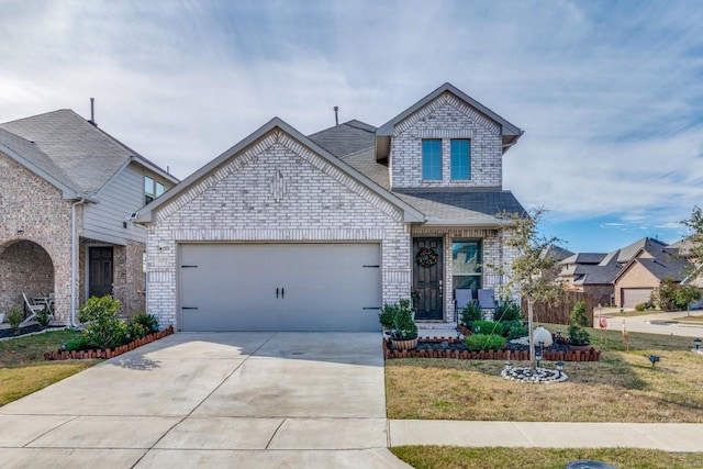 craftsman-style house with a garage and a front lawn