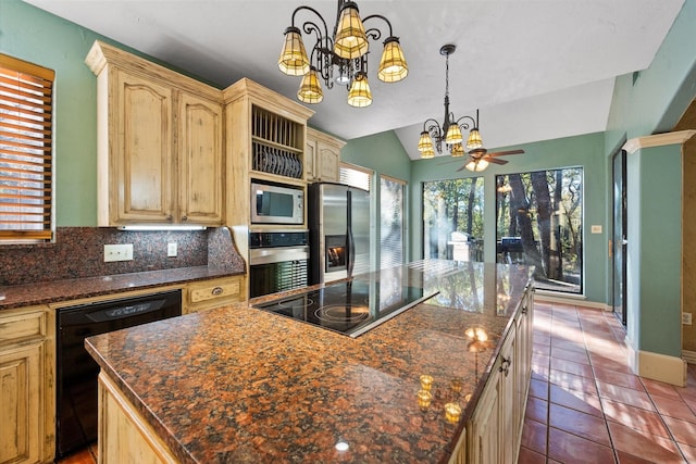 kitchen featuring black appliances, vaulted ceiling, ceiling fan with notable chandelier, and a kitchen island