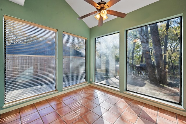 unfurnished sunroom featuring ceiling fan and vaulted ceiling