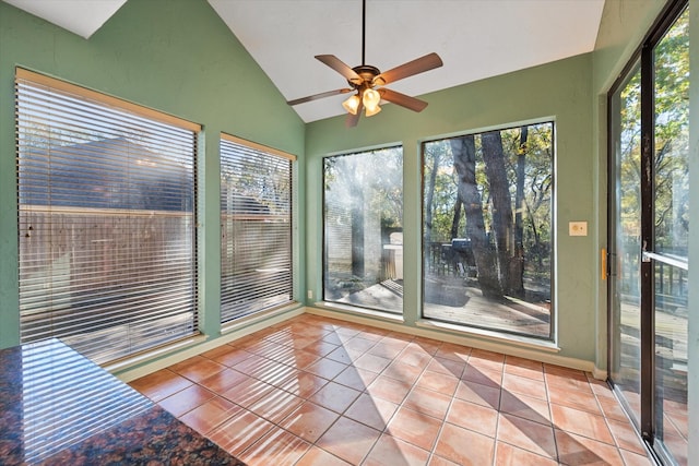 unfurnished sunroom featuring lofted ceiling and ceiling fan