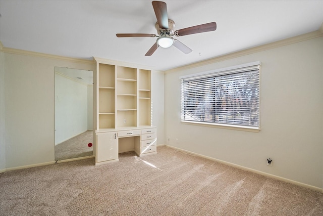 unfurnished bedroom with light carpet, ceiling fan, and crown molding