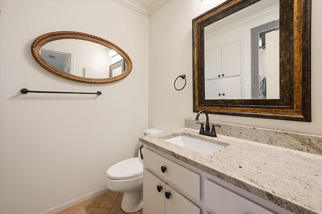 bathroom with toilet, vanity, tile patterned floors, and ornamental molding