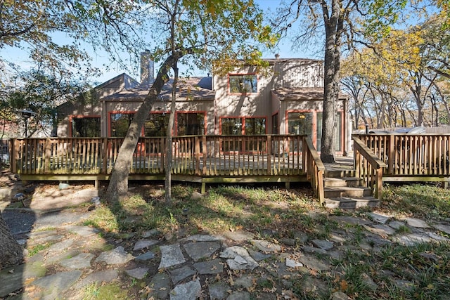 rear view of property with a deck