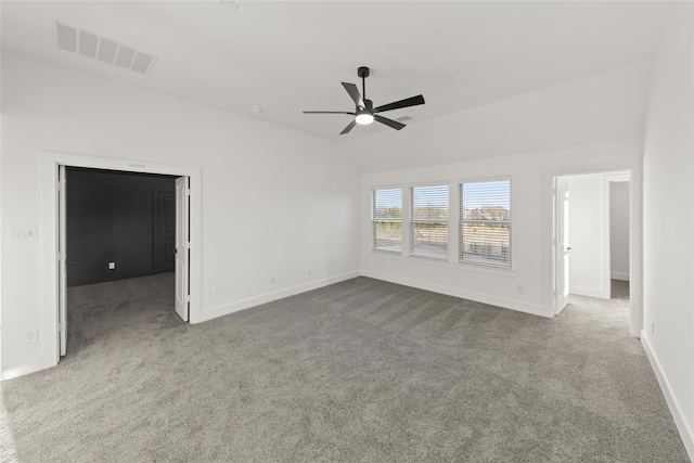 carpeted empty room with lofted ceiling and ceiling fan