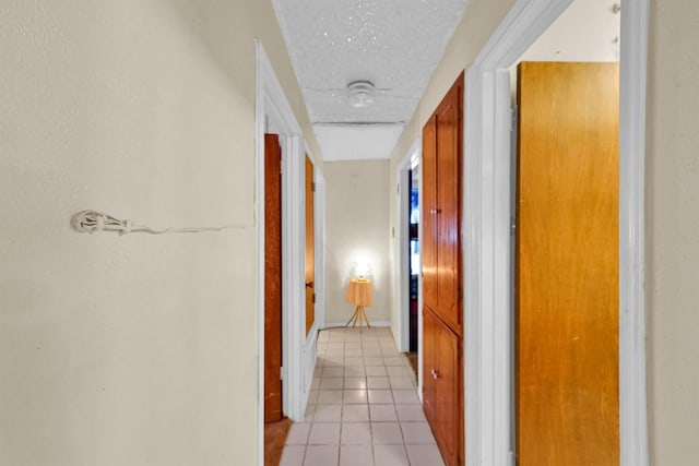 hallway with light tile patterned floors