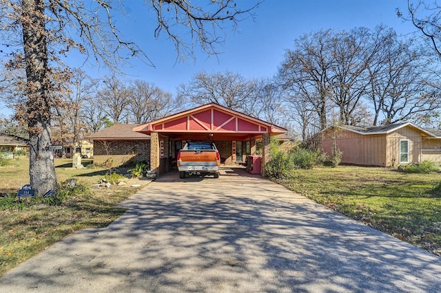 view of front of house with a front yard and a carport