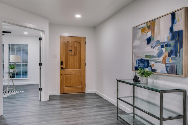 foyer entrance featuring recessed lighting, baseboards, and wood finished floors