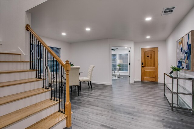 interior space with recessed lighting, wood finished floors, visible vents, and baseboards