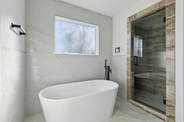 full bathroom with a freestanding bath, marble finish floor, a sauna, and a stall shower