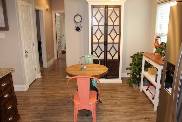 dining area featuring french doors and dark hardwood / wood-style floors