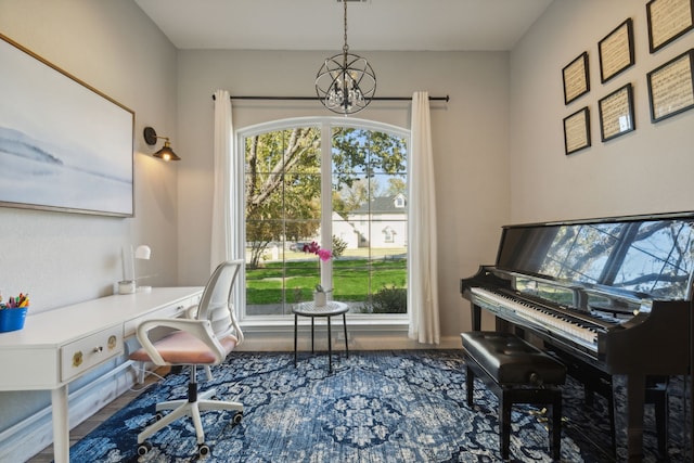 home office featuring a healthy amount of sunlight and a chandelier