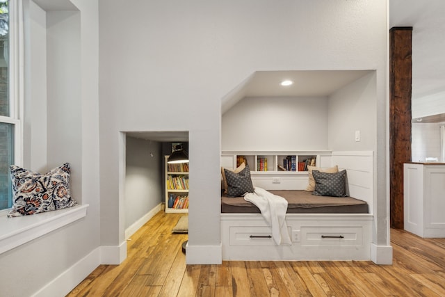 living area with light hardwood / wood-style flooring