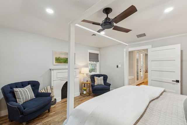 bedroom featuring ceiling fan and wood-type flooring