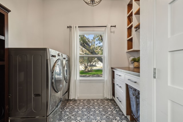 laundry area with light tile patterned flooring and washing machine and dryer