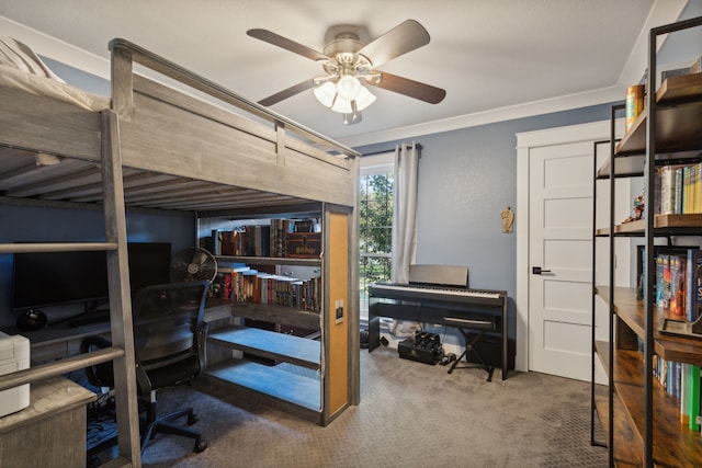 bedroom with ceiling fan, crown molding, and carpet floors