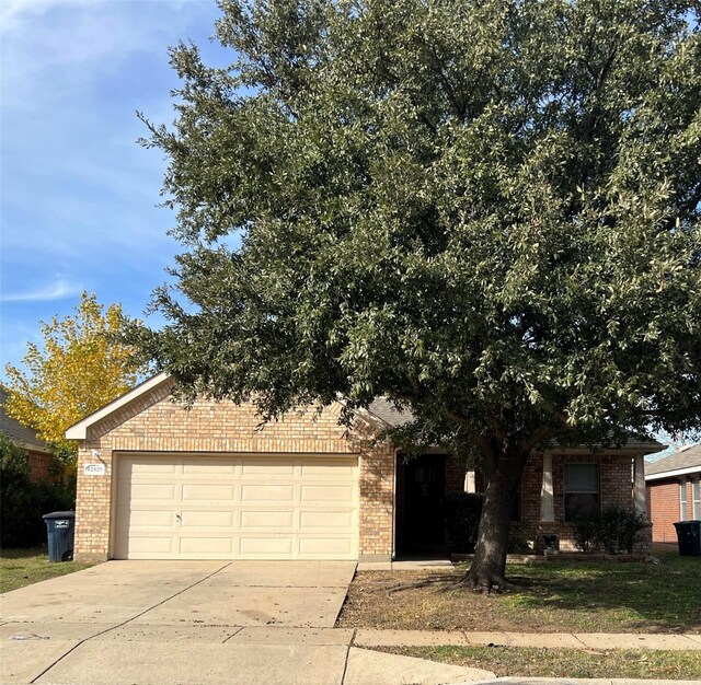 obstructed view of property featuring a garage