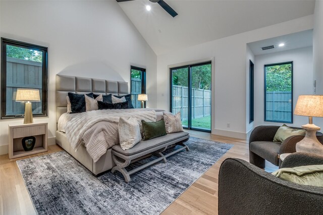 bedroom with access to exterior, multiple windows, and ceiling fan