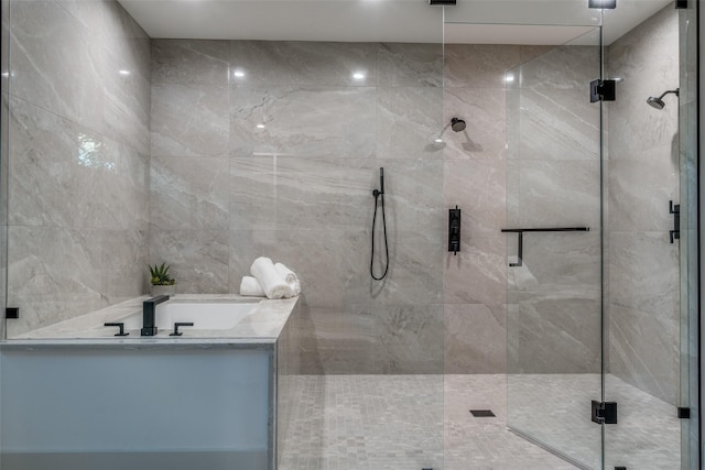 bathroom with separate shower and tub and tile walls