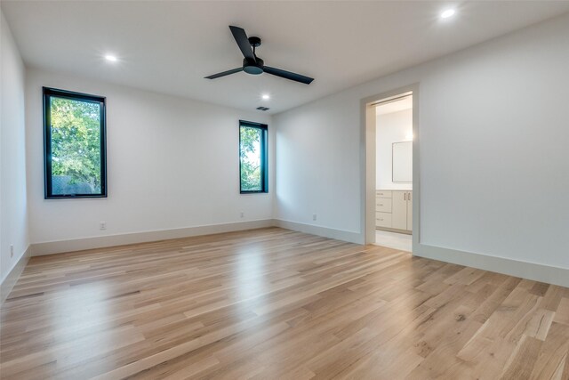 unfurnished room featuring light hardwood / wood-style flooring, a wealth of natural light, and ceiling fan