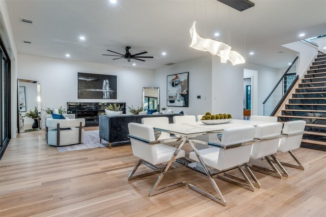 dining room featuring light hardwood / wood-style floors and ceiling fan