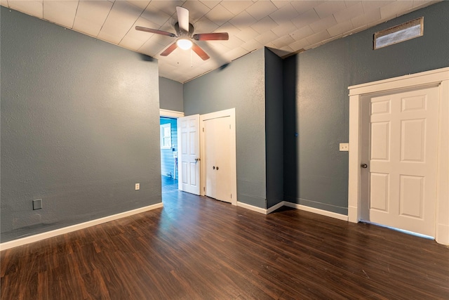 spare room with ceiling fan and dark wood-type flooring