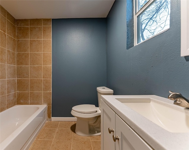 bathroom with tile patterned floors, vanity, and toilet