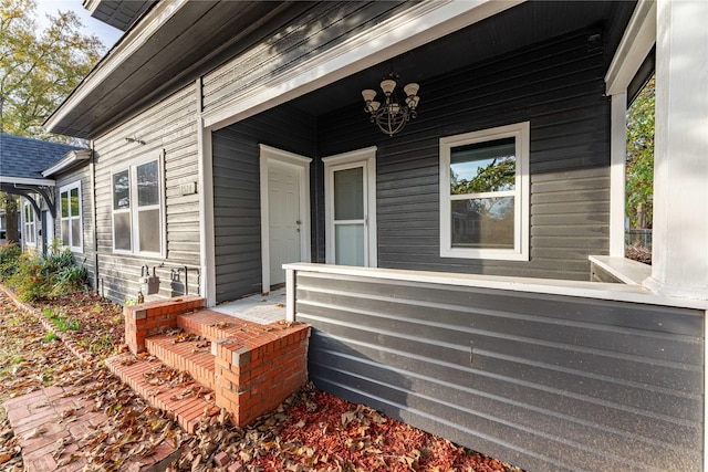 doorway to property featuring a porch