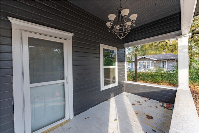 wooden terrace with a porch