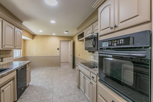 kitchen featuring black appliances, light tile patterned floors, sink, and tasteful backsplash