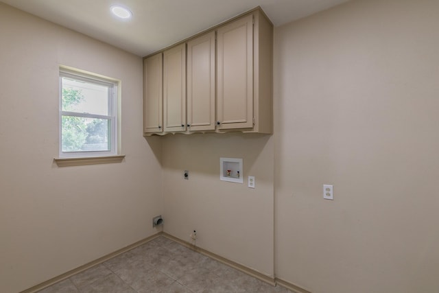 laundry room with washer hookup, cabinets, and hookup for an electric dryer