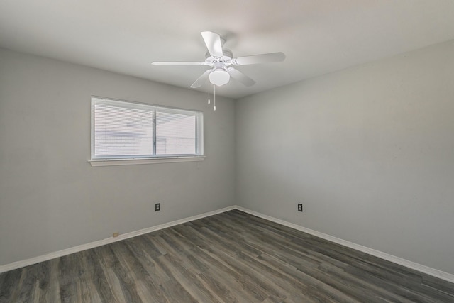 unfurnished room featuring ceiling fan and dark wood-type flooring