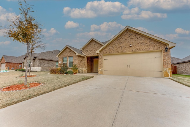 view of front facade with a front yard and a garage