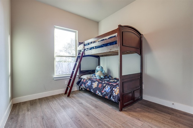 bedroom with wood-type flooring