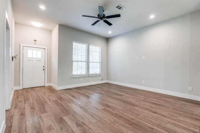 foyer entrance featuring light wood-type flooring and ceiling fan