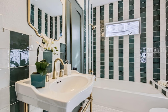 bathroom with a bath and tile walls