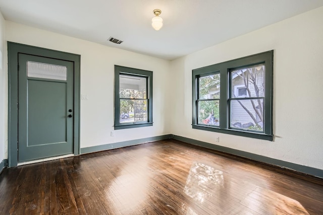 empty room featuring dark hardwood / wood-style floors