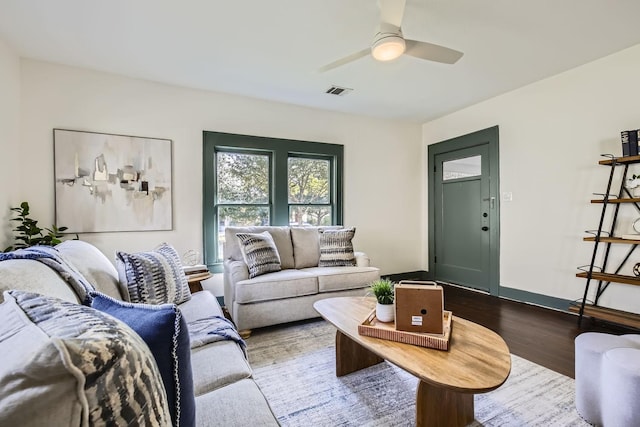 living room featuring ceiling fan and wood-type flooring