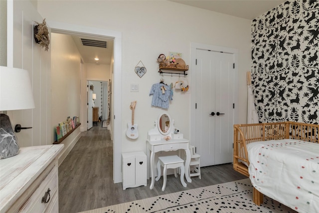 bedroom with hardwood / wood-style floors