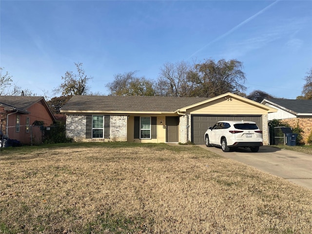 ranch-style home with a front lawn and a garage