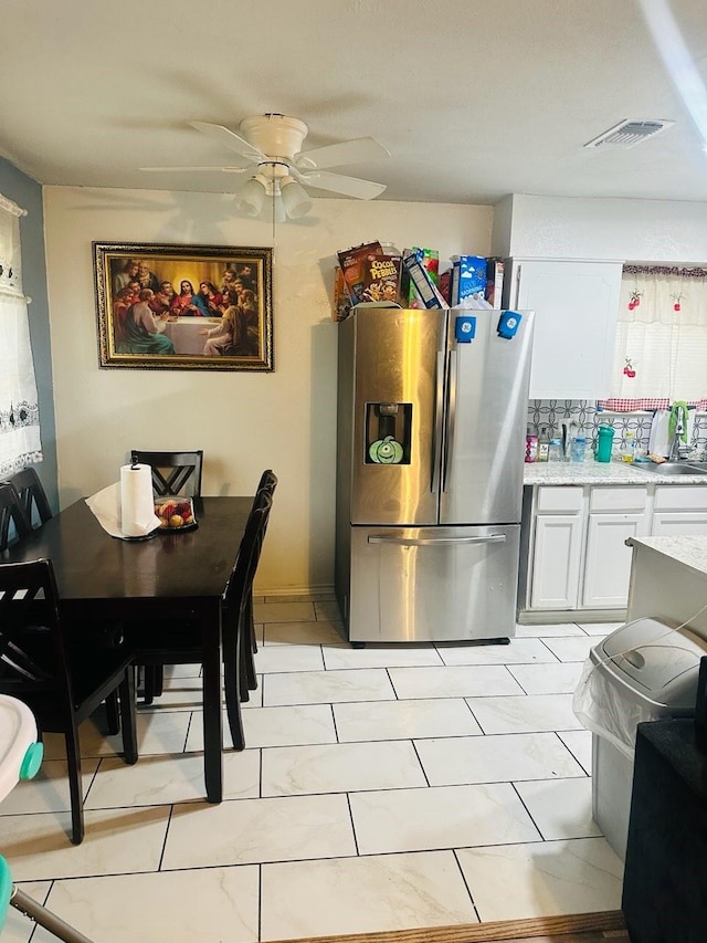 dining space featuring ceiling fan