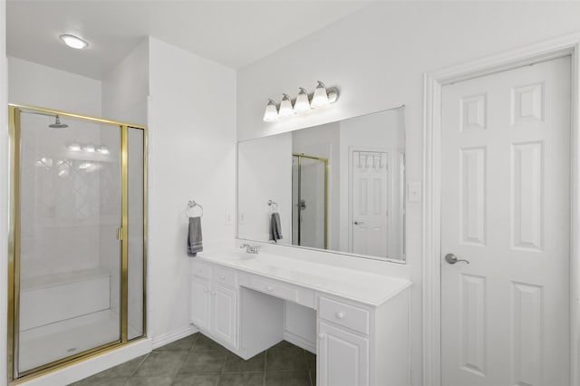 bathroom featuring tile patterned flooring, vanity, and an enclosed shower