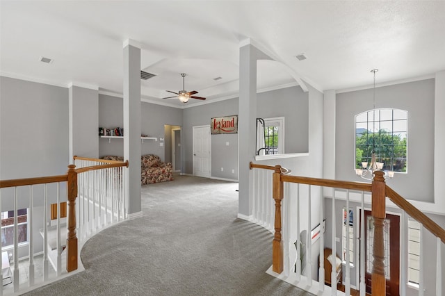 hallway featuring carpet floors and ornamental molding