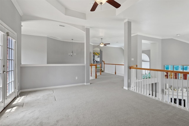 carpeted empty room with ceiling fan with notable chandelier and ornamental molding