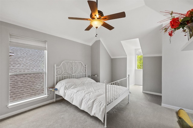 carpeted bedroom featuring ceiling fan and lofted ceiling