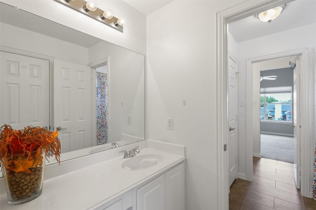 bathroom featuring vanity, tile patterned floors, and ceiling fan