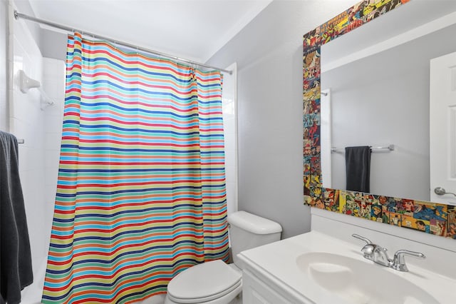 bathroom featuring a shower with curtain, vanity, and toilet