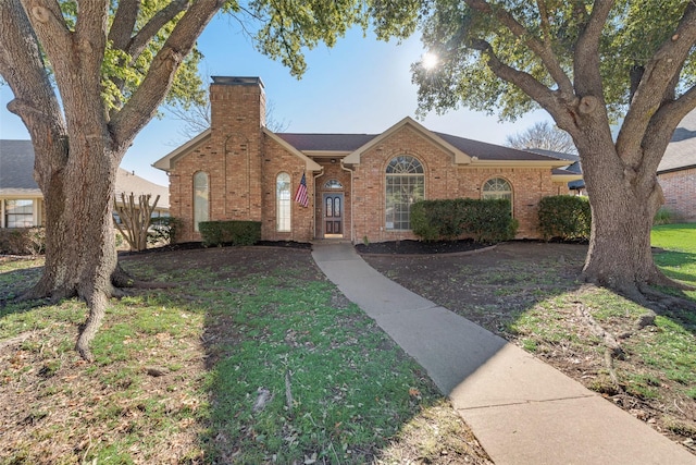 ranch-style home featuring a front yard