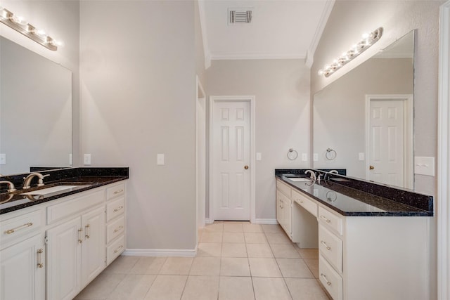 bathroom featuring tile patterned flooring, vanity, and ornamental molding