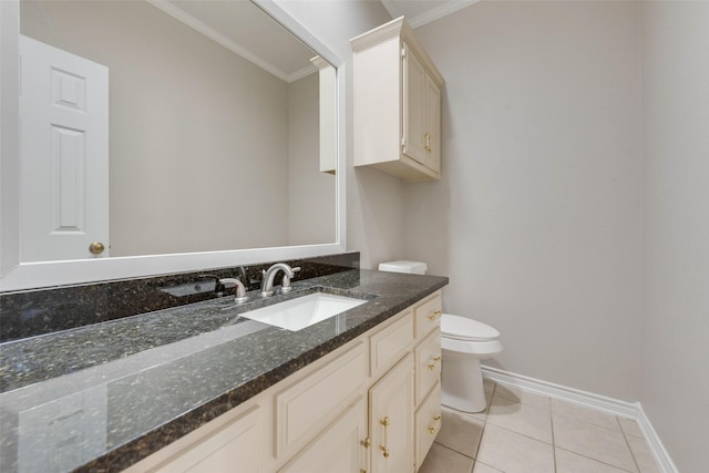 bathroom featuring toilet, vanity, tile patterned floors, and ornamental molding